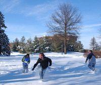 Students in the snow at the University of Northern Iowa